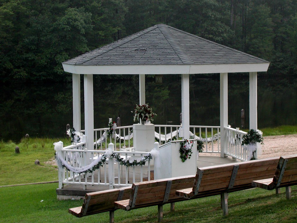 White wedding gazebo with guest seating